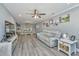 Cozy living room showcasing a comfortable seating arrangement, ceiling fan, and an inviting atmosphere at 3405 Painswick Rd, Johns Island, SC 29455