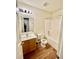 Bathroom with a wood vanity, mirror, and a shower-tub combo with white tile surround at 344 Eagle Ridge Rd, Summerville, SC 29485