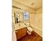 Bathroom featuring a tub-shower, modern vanity, commode, vinyl floors, and a window at 344 Eagle Ridge Rd, Summerville, SC 29485
