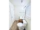 Bright bathroom featuring wood-look vinyl flooring, white fixtures and window blinds at 344 Eagle Ridge Rd, Summerville, SC 29485