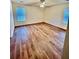 A bright bedroom featuring hardwood floors, a ceiling fan, and natural light from the windows at 344 Eagle Ridge Rd, Summerville, SC 29485