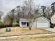 Charming single Gathering home featuring a well-maintained front yard and attached two car garage at 344 Eagle Ridge Rd, Summerville, SC 29485