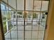 Covered screened in patio with a ceiling fan that provides a transition to outdoor living at 344 Eagle Ridge Rd, Summerville, SC 29485