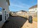 Spacious backyard featuring a stone patio with seating and a fenced perimeter at 3614 Haymont Ln, Ladson, SC 29456