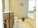 Bathroom features a tiled floor, stained wood cabinets and a built-in tub at 3614 Haymont Ln, Ladson, SC 29456