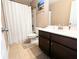 Neutral bathroom with a shower/tub combo and dark wood vanity at 3614 Haymont Ln, Ladson, SC 29456