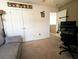 Bedroom featuring double closets, neutral carpet, and decorative superhero artwork at 3614 Haymont Ln, Ladson, SC 29456
