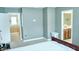 View of the bedroom features grey walls and carpet, as well as doors leading to bath and hallway at 3614 Haymont Ln, Ladson, SC 29456