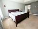 View of the large bedroom features neutral walls and carpet and a sleigh bed at 3614 Haymont Ln, Ladson, SC 29456