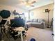 Bedroom with a sectional sofa and desk, illuminated by a modern ceiling fan at 3614 Haymont Ln, Ladson, SC 29456
