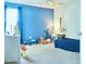 Brightly lit bedroom with a blue wall, a fan, toys, and carpeted floors at 3614 Haymont Ln, Ladson, SC 29456