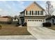Charming home with a two-car garage, neutral siding, and a well-manicured lawn at 3614 Haymont Ln, Ladson, SC 29456