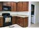 The kitchen features wood cabinets, black appliances, and durable stone countertops at 3614 Haymont Ln, Ladson, SC 29456