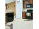 Functional kitchen featuring matching appliances, stone countertops, and tile flooring at 3614 Haymont Ln, Ladson, SC 29456