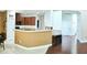 Open-concept kitchen with wood cabinets, stone countertops, and convenient breakfast bar at 3614 Haymont Ln, Ladson, SC 29456