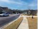 Picturesque street view in suburban neighborhood with sidewalks and tree-lined streets at 3614 Haymont Ln, Ladson, SC 29456