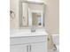 This half bathroom has a white vanity with a silver faucet, a modern sink, and a toilet at 3726 Apiary Ln, Johns Island, SC 29455