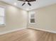 Bright bedroom featuring wood-look floors, neutral walls, and a ceiling fan at 3726 Apiary Ln, Johns Island, SC 29455