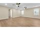 Spacious bedroom features luxury vinyl plank floors, neutral paint, recessed lighting, and ceiling fans at 3726 Apiary Ln, Johns Island, SC 29455