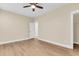 Bright bedroom with ceiling fan, luxury vinyl plank flooring, and en suite bathroom access at 3726 Apiary Ln, Johns Island, SC 29455