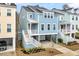 Charming elevated beach home with HardiePlank siding, white railings, and convenient garage parking at 3726 Apiary Ln, Johns Island, SC 29455