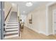 Inviting foyer featuring hardwood floors, a staircase, and natural light, perfect for welcoming guests at 3726 Apiary Ln, Johns Island, SC 29455
