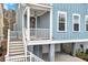 Inviting front porch features a pendant light and staircase leading to the main level at 3726 Apiary Ln, Johns Island, SC 29455