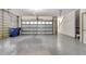 Spacious two car garage with sealed concrete floors and ample lighting at 3726 Apiary Ln, Johns Island, SC 29455