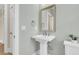 Cozy powder room featuring a pedestal sink and neutral colors, ideal for guests and convenience at 3726 Apiary Ln, Johns Island, SC 29455