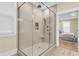 Modern, tiled walk-in shower with glass enclosure, handheld sprayer, and built-in niche at 3726 Apiary Ln, Johns Island, SC 29455
