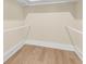 Walk-in closet with installed closet rod and beautiful hardwood floors at 3726 Apiary Ln, Johns Island, SC 29455