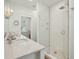 Bright bathroom with double sink vanity, marble countertop and a glass enclosed shower with rain shower head at 402 Rose Wilder Ln, Mount Pleasant, SC 29464