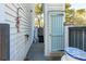 Side yard view features an outdoor shower, brick-lined walkway, and blue shutters at 402 Rose Wilder Ln, Mount Pleasant, SC 29464