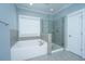 This bathroom features a glass shower and a garden tub at 414 Hamlet Cir, Goose Creek, SC 29445
