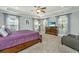 This bedroom features a tray ceiling, ceiling fan, and bright natural light at 414 Hamlet Cir, Goose Creek, SC 29445