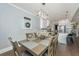 Bright dining area showcasing hardwood floors with open view into the kitchen at 414 Hamlet Cir, Goose Creek, SC 29445