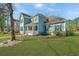 Charming two-story home with a well-maintained lawn and inviting front porch at 414 Hamlet Cir, Goose Creek, SC 29445