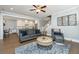 Cozy living room with open floor plan and hardwood floors and modern decor at 414 Hamlet Cir, Goose Creek, SC 29445