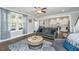 Bright living room with open floor plan, hardwood floors, and kitchen view at 414 Hamlet Cir, Goose Creek, SC 29445