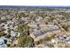 Scenic aerial view of an apartment complex nestled among lush greenery and mature trees, featuring a sparkling community pool at 415 Parkdale Dr # 12B, Charleston, SC 29414