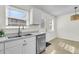 Well-lit kitchen featuring stainless steel appliances, white cabinets, and sleek countertops at 415 Parkdale Dr # 12B, Charleston, SC 29414