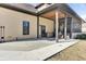 A covered back porch with stained wood ceiling and railing leads to a backyard at 4162 Club Course Dr, North Charleston, SC 29420
