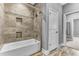 Elegant bathroom with a tiled shower over a bathtub with built in shampoo shelves and a shower head at 4162 Club Course Dr, North Charleston, SC 29420