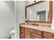 Elegant bathroom features a granite vanity with a decorative mirror and traditional-style fixtures at 4162 Club Course Dr, North Charleston, SC 29420