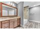 Modern bathroom featuring a granite vanity, a large mirror, and a tiled shower with a bathtub at 4162 Club Course Dr, North Charleston, SC 29420