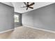 Comfortable bedroom features carpeted floors, gray walls, ceiling fan, and natural light from the window at 4162 Club Course Dr, North Charleston, SC 29420