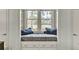 Comfortable window nook with blue throw pillows and view to backyard at 4162 Club Course Dr, North Charleston, SC 29420