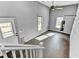 Versatile bonus room with high ceilings, natural light, and a punching bag setup, perfect for a gym at 4162 Club Course Dr, North Charleston, SC 29420