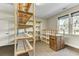 Spacious closet with carpeted floors, wooden shelving, a window bringing in natural light, and a door at 4162 Club Course Dr, North Charleston, SC 29420