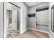Walk-in closet offering carpet floors, built-in shelving, and a door leading to the adjacent bathroom at 4162 Club Course Dr, North Charleston, SC 29420